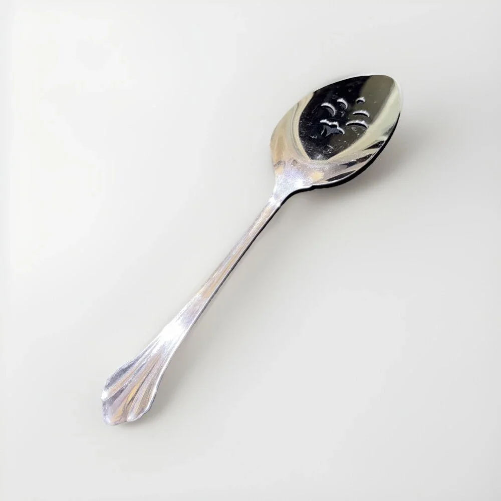 Oneida Community Royal Flute pierced pie server in stainless steel. 9.5”